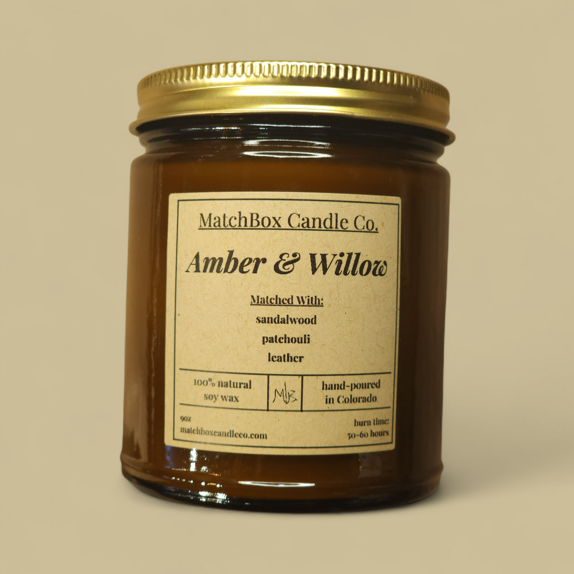 Candle jar with 'MatchBox Candle Co.' label on a beige background